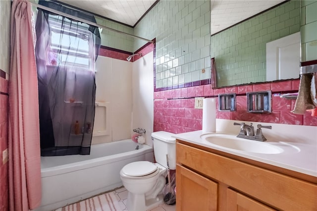 bathroom with washtub / shower combination, toilet, vanity, and tile walls