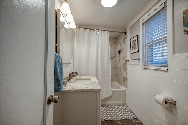 full bath featuring vanity, shower / bath combination with curtain, and tile patterned floors