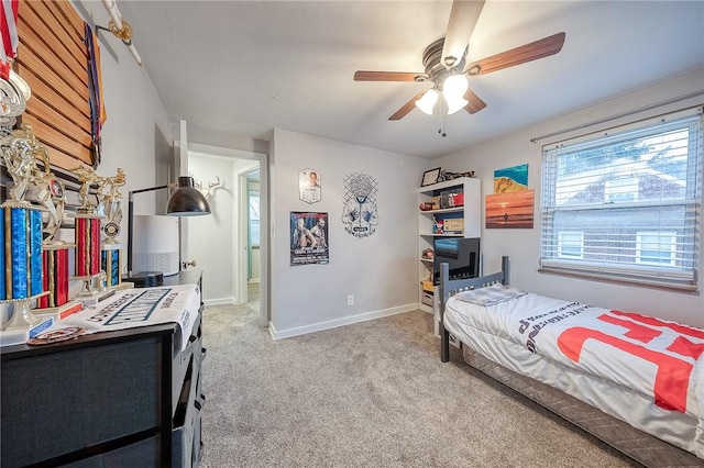 bedroom with carpet, baseboards, and a ceiling fan