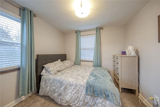 bedroom featuring baseboards and carpet flooring