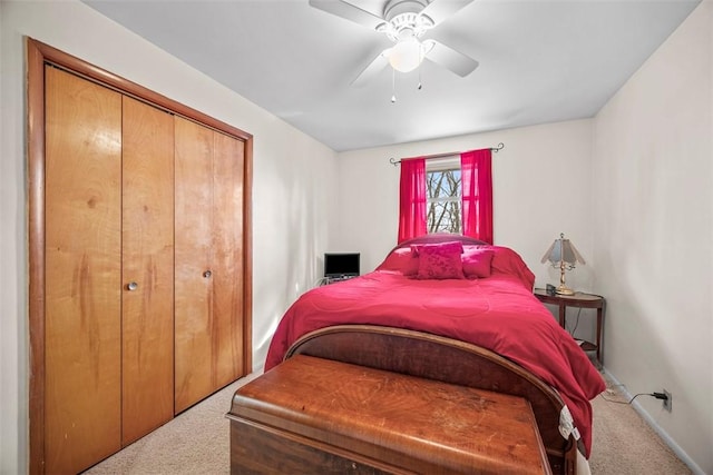 bedroom featuring a closet, a ceiling fan, and carpet flooring