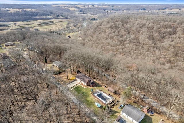 birds eye view of property with a rural view