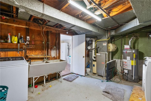 unfinished basement featuring washer / clothes dryer, gas water heater, and a sink