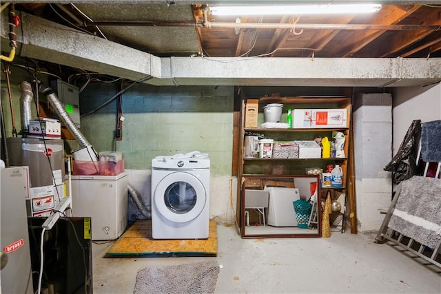 clothes washing area featuring washing machine and dryer and laundry area