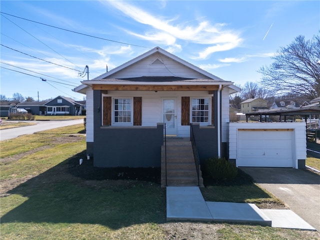 bungalow-style home with driveway and a front lawn