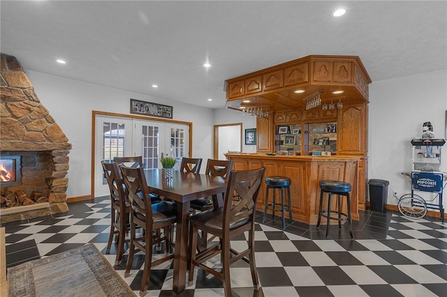 dining room with dark floors, french doors, baseboards, and recessed lighting