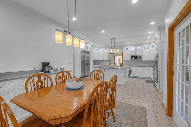 dining space featuring recessed lighting