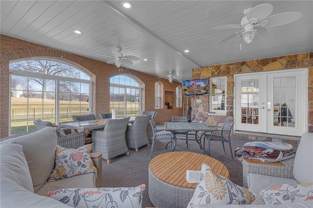 view of patio / terrace featuring french doors, outdoor dining space, outdoor lounge area, and a lanai