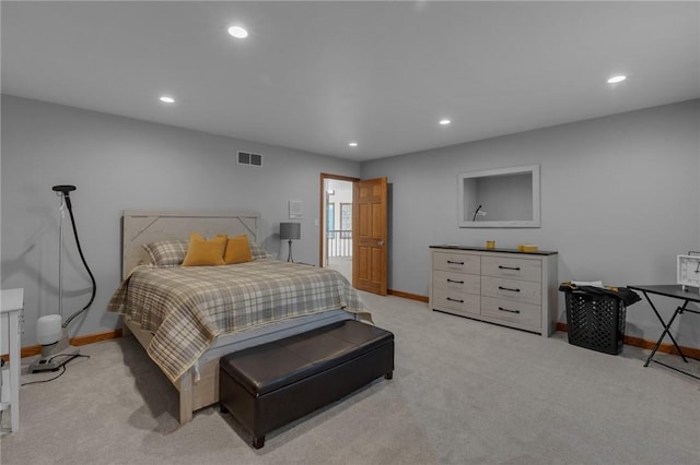 bedroom with recessed lighting, visible vents, light carpet, and baseboards