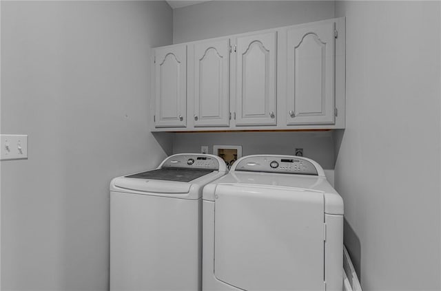 laundry area featuring cabinet space and washer and dryer