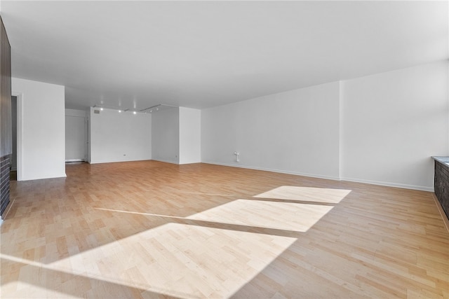 unfurnished living room with light wood-type flooring