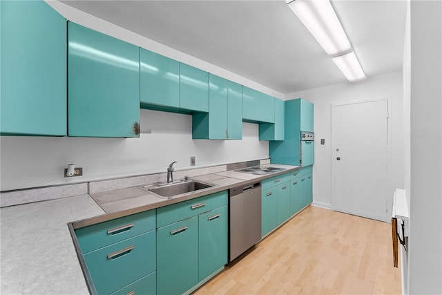 kitchen featuring a sink, light countertops, white electric cooktop, dishwasher, and light wood finished floors