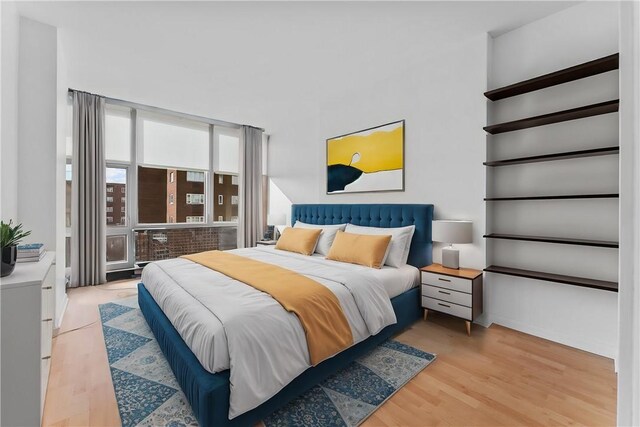 bedroom with light wood-type flooring