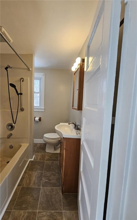 bathroom featuring bathtub / shower combination, baseboards, vanity, and toilet