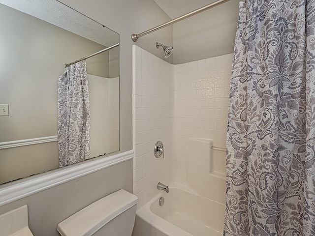 full bathroom with shower / tub combo and toilet