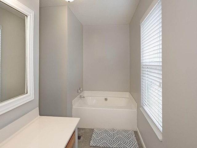 full bath featuring a bath and vanity