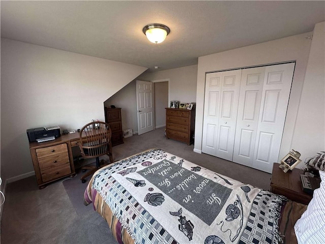 carpeted bedroom with baseboards and a closet