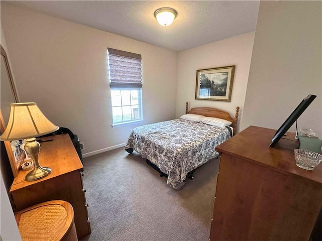 carpeted bedroom with baseboards