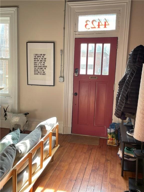 mudroom featuring a wealth of natural light and light wood-style flooring