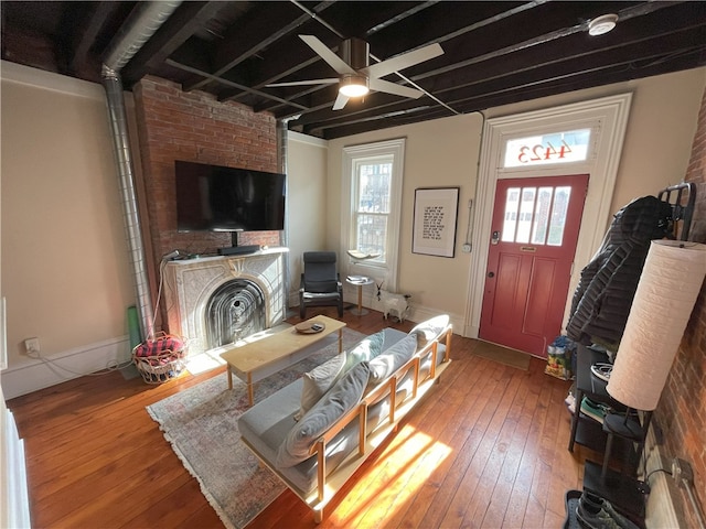 living room featuring a healthy amount of sunlight, hardwood / wood-style flooring, and ceiling fan