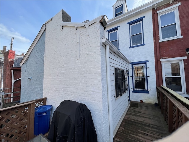 view of side of property with brick siding