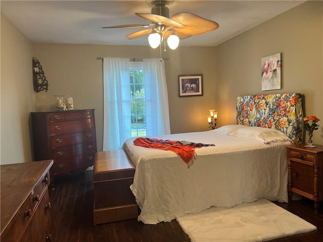 bedroom featuring dark wood-style floors and a ceiling fan