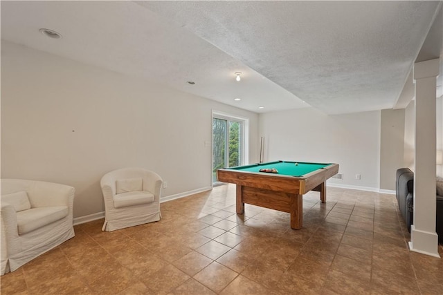 recreation room featuring billiards, a textured ceiling, and baseboards