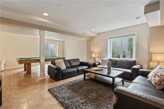 living room with recessed lighting, pool table, a textured ceiling, and light tile patterned floors