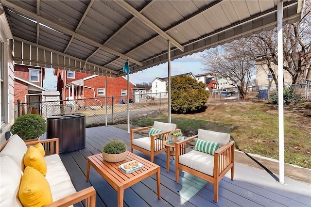 deck with a residential view, fence, an outdoor hangout area, and a yard