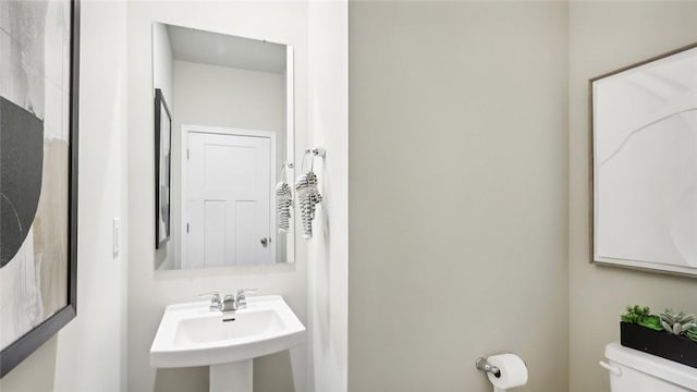 bathroom with a sink and toilet