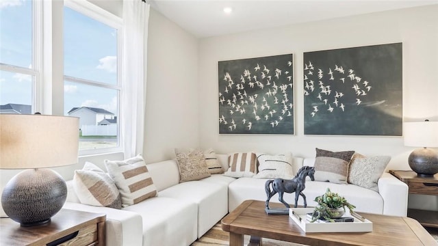 living room with a healthy amount of sunlight and recessed lighting