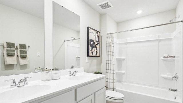 full bathroom featuring a sink, shower / bath combination with curtain, toilet, and visible vents