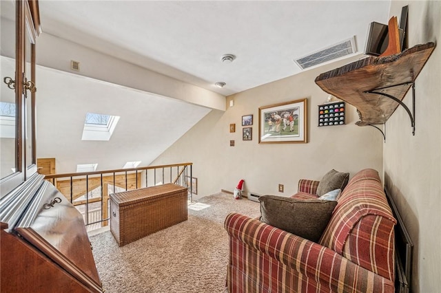 living area with lofted ceiling with skylight, carpet flooring, and visible vents