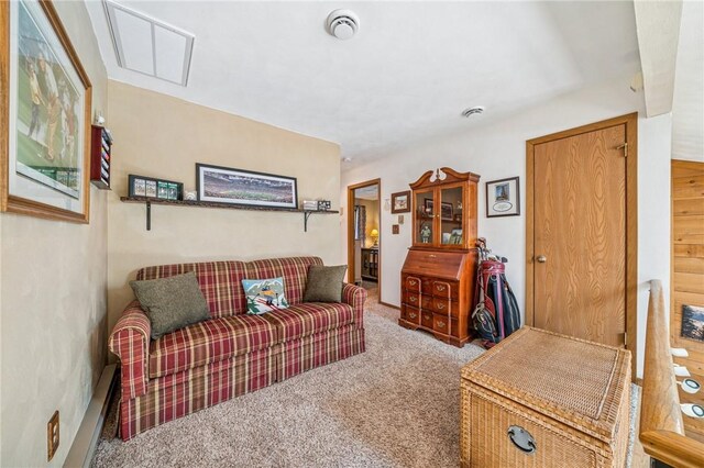 living area featuring carpet flooring