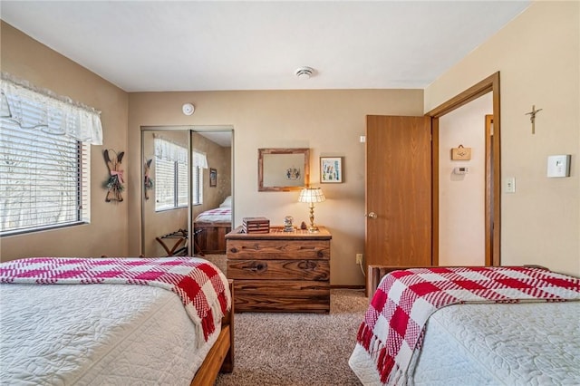 bedroom featuring carpet floors and a closet