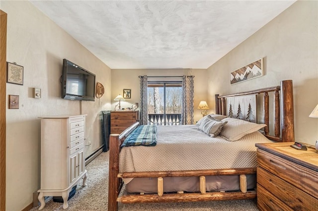 carpeted bedroom featuring access to exterior