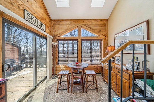 sunroom / solarium with lofted ceiling with skylight