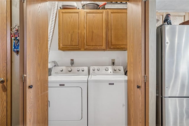 washroom with washer and dryer