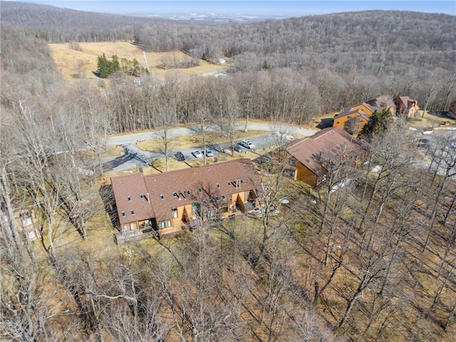 drone / aerial view featuring a forest view