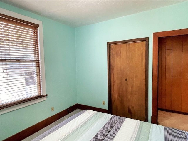 unfurnished bedroom featuring baseboards