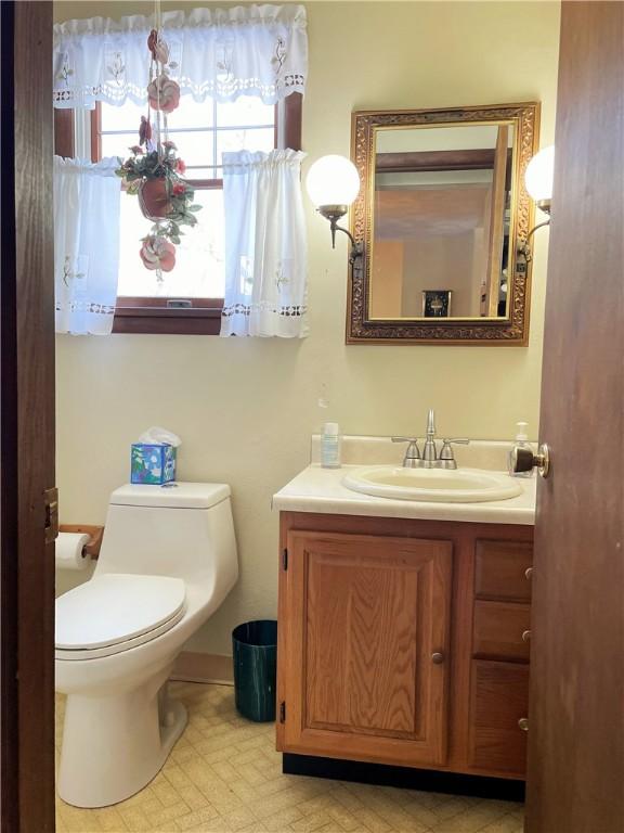 bathroom with vanity and toilet