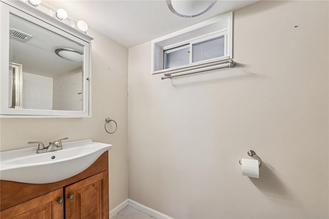 bathroom with visible vents, tile patterned floors, vanity, and baseboards