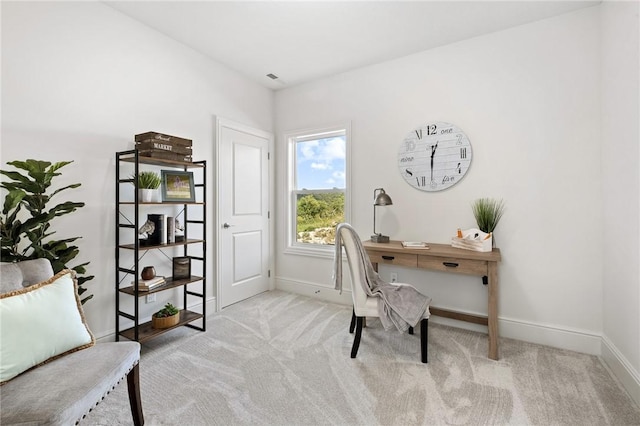 carpeted home office with visible vents and baseboards