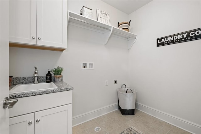 laundry area with hookup for a washing machine, cabinet space, a sink, electric dryer hookup, and baseboards