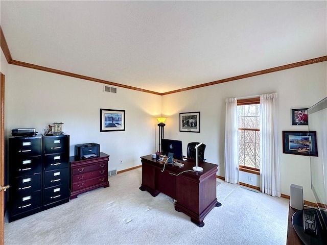 home office with light colored carpet, visible vents, crown molding, and baseboards