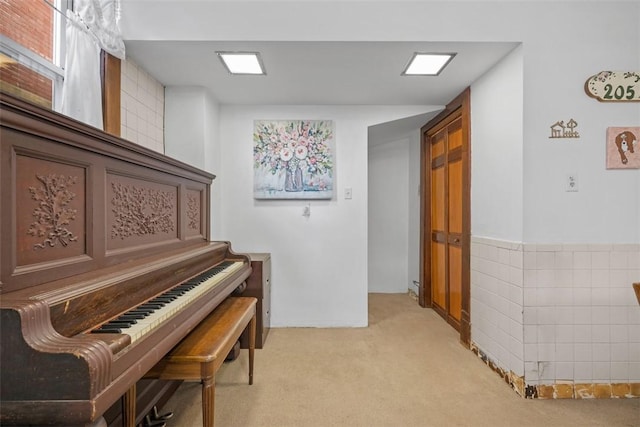 living area with light carpet