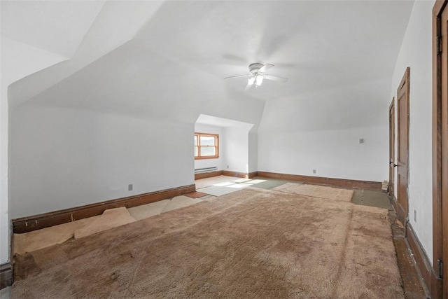 bonus room with carpet floors, a baseboard heating unit, a ceiling fan, vaulted ceiling, and baseboards