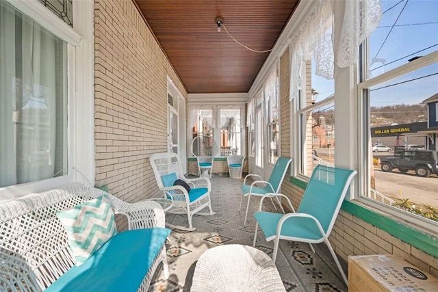 sunroom with wooden ceiling