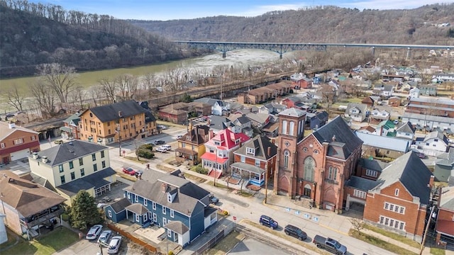 drone / aerial view featuring a forest view and a residential view