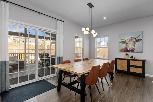 dining area featuring a chandelier, baseboards, wood finished floors, and recessed lighting